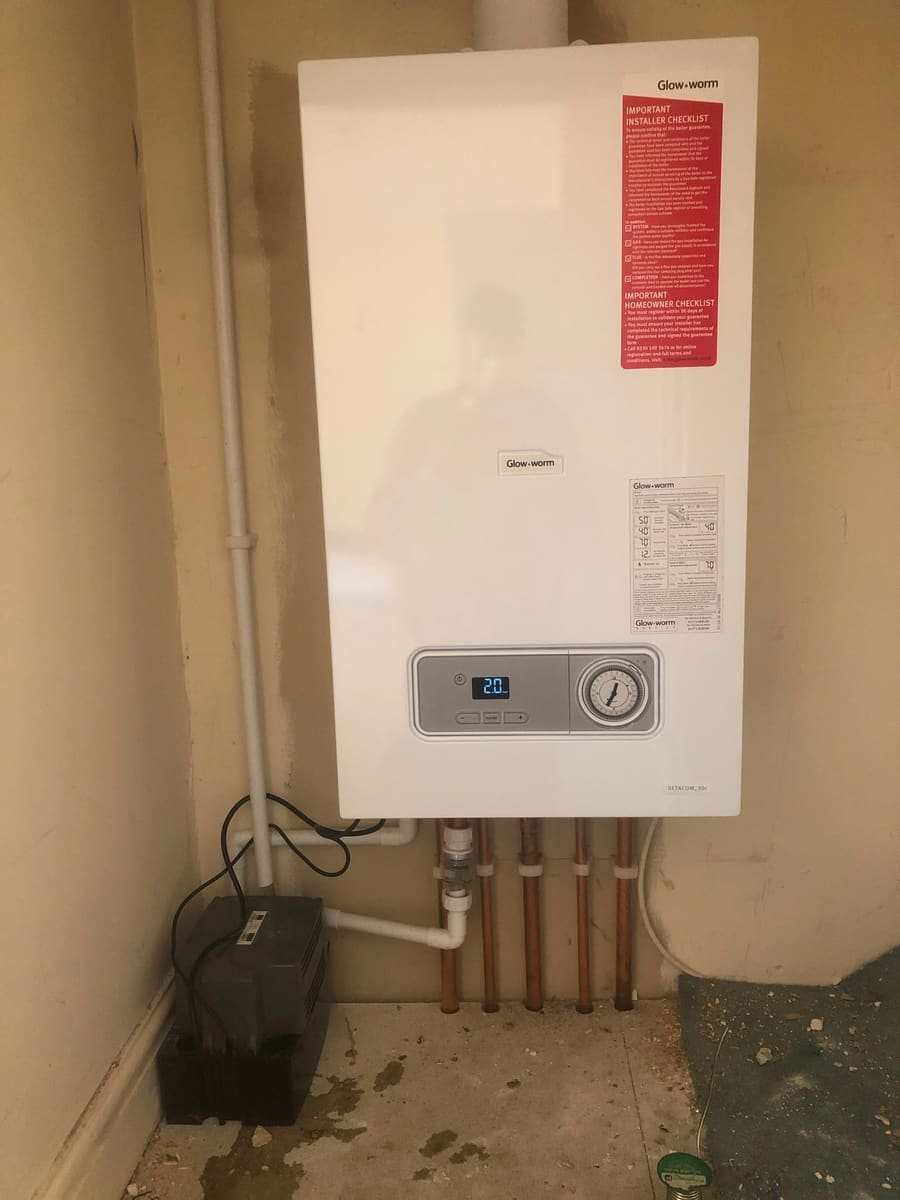 Wall-mounted combi boiler installation