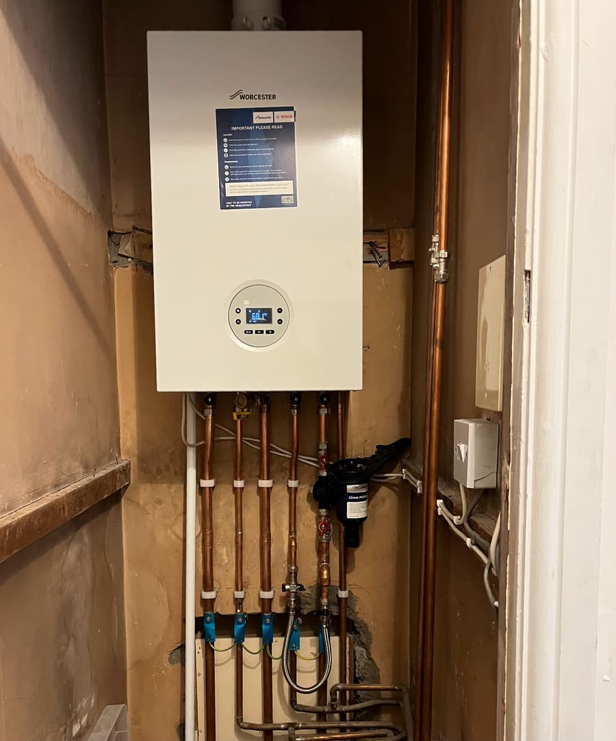 Gas boiler installed by BOILR+ with neat copper pipework